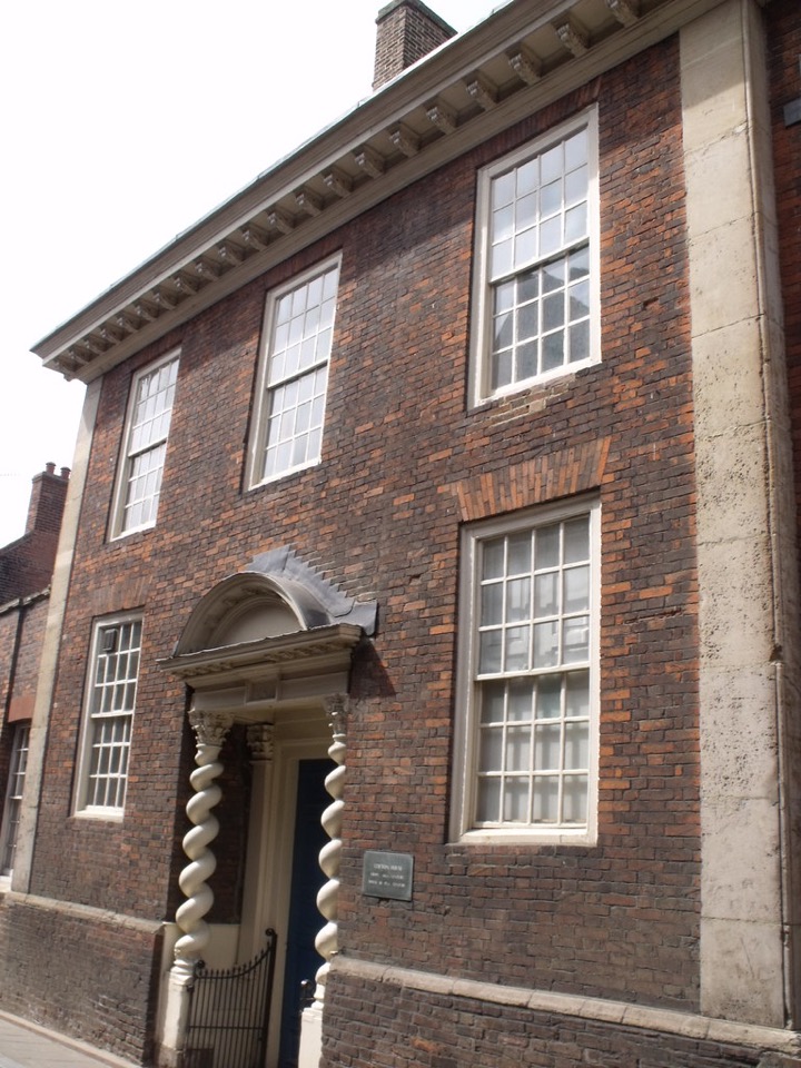 A Georgian brick townhouse frontage on Queen Street in King’s Lynn, Norfolk